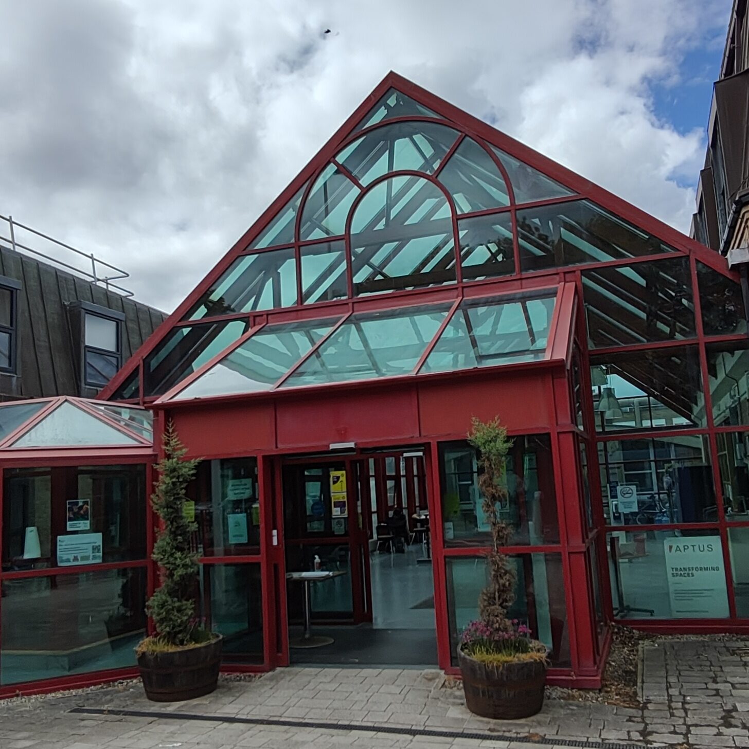 Red-framed greenhouse-style building.