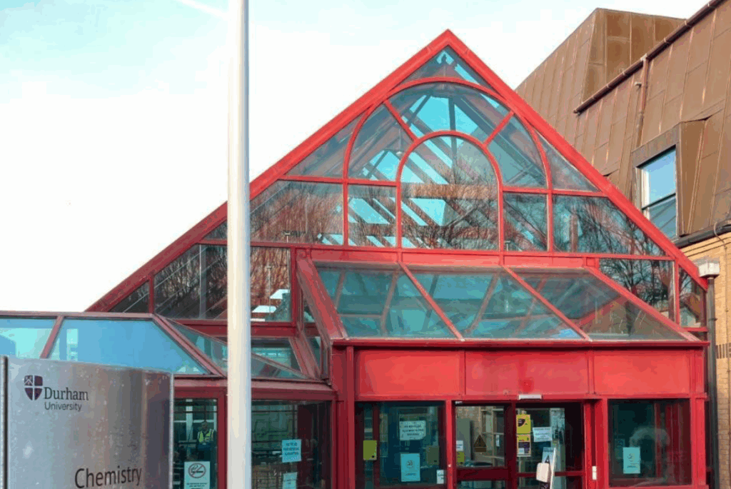 A red greenhouse-style building.